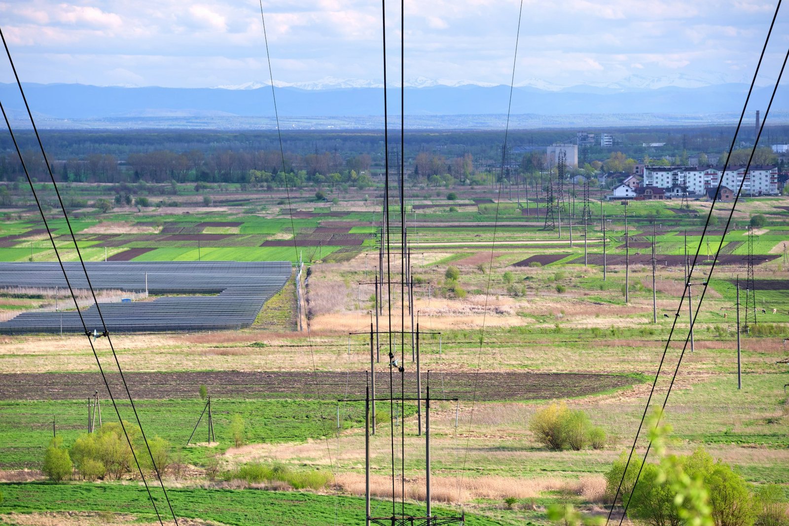 Steel pillar with high voltage electric power lines delivering electrical energy through cable wires